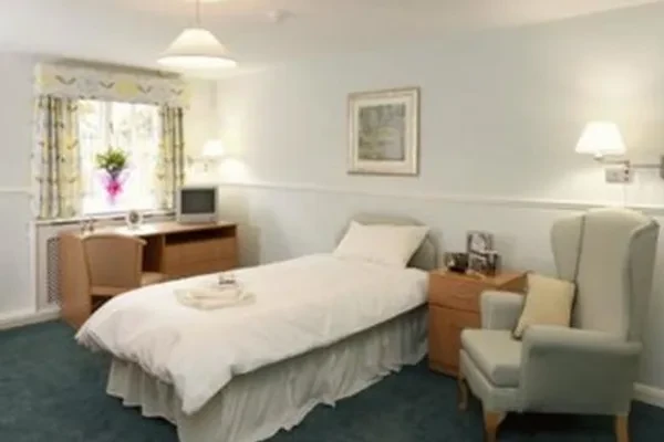 A bright, freshly made-up bedroom at The Cedars and Larches